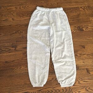 size xs, light grey sweatpants, pockets, elastic waste with drawstring